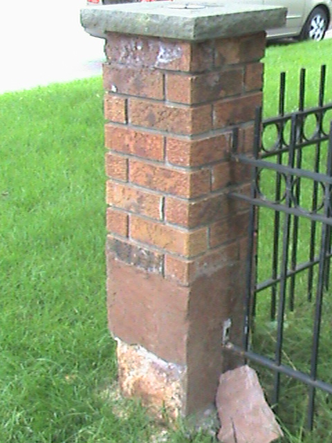 Brick post in need of repair.