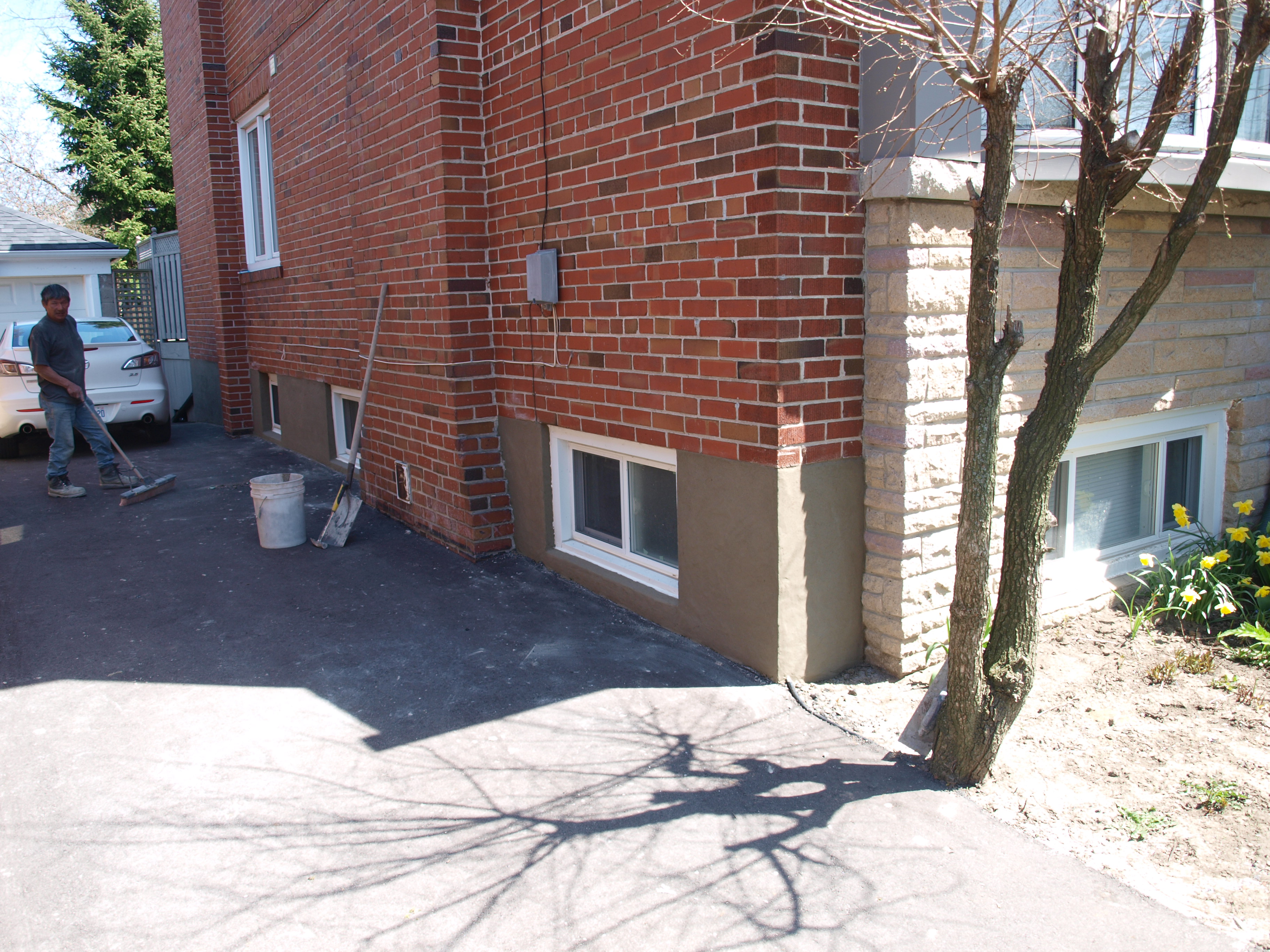 Masonry workers Tuckpointing in Toronto.