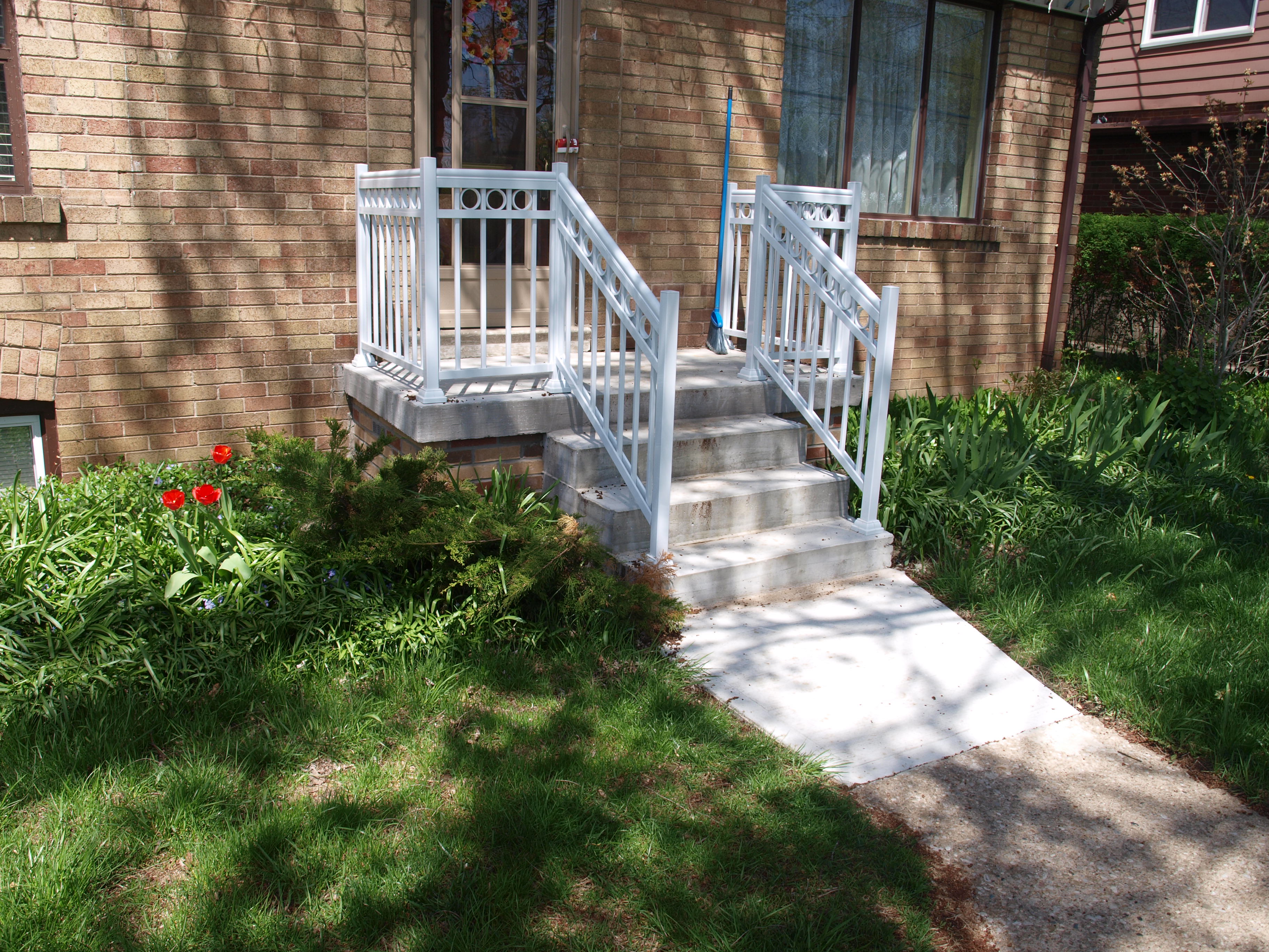 Concrete stairs and front porch.