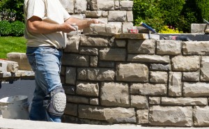 stone mason building a beautiful stone structure.