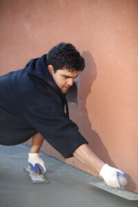 Finishing the concrete patio with brushing